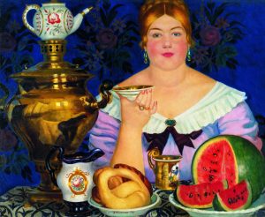 Картина Бориса Кустодиева «Купчиха, пьющая чай» (1923). В левом нижнем углу — калач старинной формы в виде замка с дужкой. Считается, что они породили выражение «Дойти до ручки»